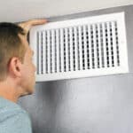 Inspecting a Home Air Vent for Maintenance